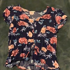 navy blue top with flowers on it